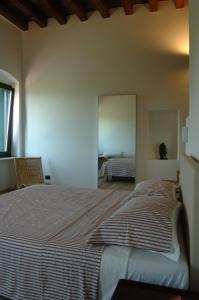 Postel nebo postele na pokoji v ubytování Agriturismo Nicobresaola