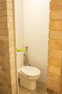 a bathroom with a white toilet in a room at Cozy peak suite in Majdal Shams +32 photos