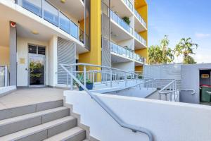 a building with stairs in front of it at The Skyline Lookout Pool, BBQ, FREE parking in Stuart Park