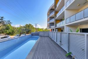a swimming pool on the side of a building at The Skyline Lookout Pool, BBQ, FREE parking in Stuart Park