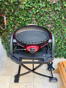 a grill sitting in front of a wall at Cozy peak suite in Majdal Shams