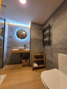 a bathroom with a sink and a mirror at Sweet Dreams Úbedas in Talavera de la Reina +34 photos