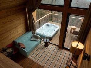 an overhead view of a jacuzzi tub on a deck at Merengő lombház in Nagymaros +26 photos