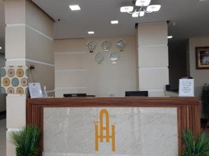 a counter with a chair sitting on top of it at Alpha Suites Salalah in Salalah