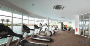 a gym with a bunch of exercise bikes in a building at Wellsuits Putrajaya in Putrajaya