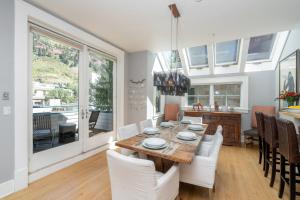a kitchen and dining room with a table and chairs at East Side Hideaway in Telluride +19 photos