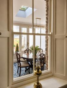 a dining room with a window with a table and chairs at NO 60 Sligo in Sligo