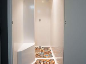 a white cabinet with a tile floor in a room at hotelF1 Brive Ussac in Ussac +34 photos