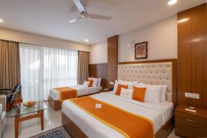 a hotel room with two beds and a window at Zone Connect by The Park Katra in Katra +99 photos