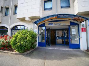 a building with the front door of a bus nursery at ibis budget Blois Centre in Blois