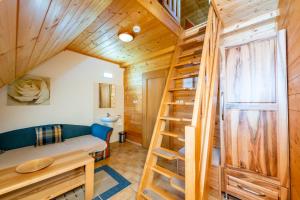 a tiny house with a staircase in a room at Salaš Vígľaš in Bojnice