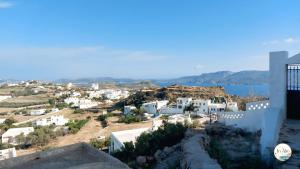 a view of a city from a building at In Alto in Plaka Milou
