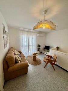 a living room with a couch and a table at Casa en el centro de Nerja- Calle Nueva 21 in Nerja