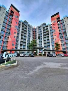 a parking lot in front of large apartment buildings at LS homestay Ipoh in Chemor