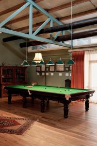 a green pool table in a room with a ceiling at Anapea Village in Tkhilistskaro