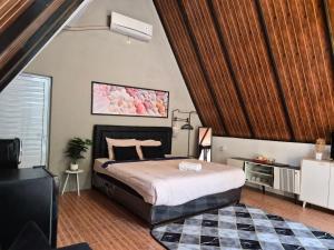a bedroom with a large bed and a rug at Aira Private Pool Glamping in Bandung +9 photos