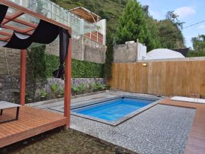 a swimming pool in the backyard of a house at Aira Private Pool Glamping in Bandung