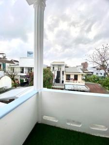 a view from the balcony of a house at New Sala Homestay in Hue +15 photos