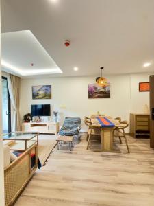 a living room with a table and chairs at Lia Home in Sapa