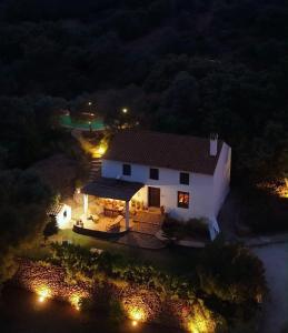 an aerial view of a white house at night at Finca Santa Teresa, Casa Grande in Estepona