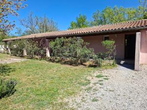 a house with a yard in front of it at Les Murmures de la Forêt Bed and Breakfast in Lanas