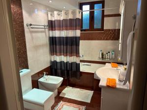 a bathroom with a toilet sink and a shower at Harision Residence in Sparta +28 photos