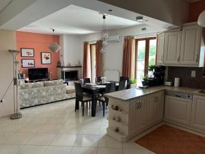 a kitchen and living room with a table and chairs at Harision Residence in Sparta