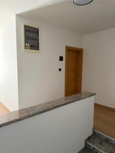 an empty room with a white wall and a door at Gaja in Križpolje