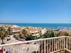 a view of the beach from the balcony of a apartment at Parquemar III-IV Solo Familias!!! Serviplaya in Playa de Xeraco