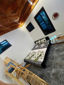 an aerial view of a room with a bed and chairs at NinhBinh Central Homestay l Green Path in Xuân Sơn