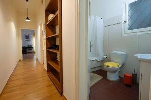a bathroom with a toilet and a sink at Amimoni Apartment in Nafplio +33 photos