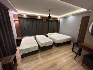 a room with two beds in a room with at Basilis Hotel in Istanbul