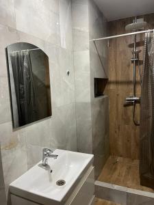 a bathroom with a sink and a shower with a mirror at Villa Maria in Slavske +63 photos