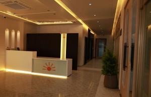 a lobby with a reception desk in a building at Novosol Lux- A Premium Hotel Near Airport in Jaipur