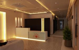 a lobby with a reception desk in a building at Novosol Lux- A Premium Hotel Near Airport in Jaipur