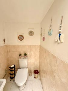 a bathroom with a toilet and a sink at Arsinoe Guest House in Famagusta