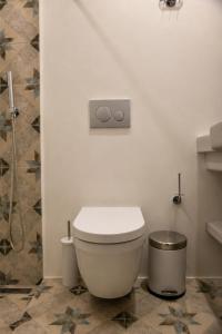 a bathroom with a toilet and a shower at Mare Bay in Adamantas