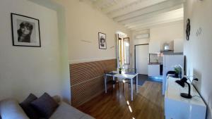 a living room with a couch and a table at Cavour 35 in Sulbiate