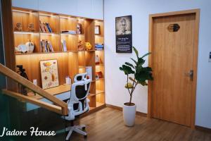 a room with a desk and a door and a plant at Jadore House in Danang +12 photos