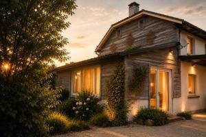 an old house with the sunset in the background at Kamer midden in de Ardennen in Amblève