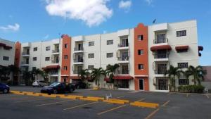 a parking lot in front of a large building at Apartment Ñ4 in La Grúa