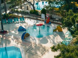an overhead view of a large swimming pool with an inflatable at Pirates Beach Club -Ultra All Inclusive in Tekirova