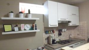 A kitchen or kitchenette at Domus Tua