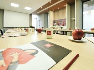 a conference room with a table with an apple on it at Ibis Casa Voyageurs in Casablanca