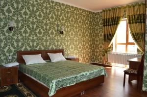 מיטה או מיטות בחדר ב-Shokhjakhon Parvoz