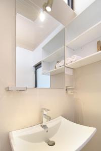 a bathroom with a sink and a mirror at The Chillout Ella in Ella +94 photos