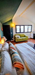 two large beds in a room with a couch at Rezen Villas in Lorca
