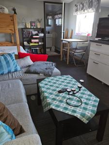 a living room with two couches and a table at Klevenius in Gnesta
