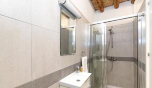 a white bathroom with a shower and a sink at Annis House in Kato Lefkara +17 photos