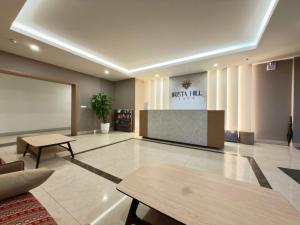 a lobby with a waiting area with a table at Lia Home in Sapa